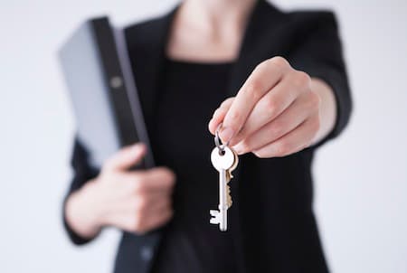 Home buyer receiving the keys to a new home